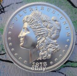 2 oz. MORGAN DOLLAR 1878 tribute thick BU round. 999 fine silver